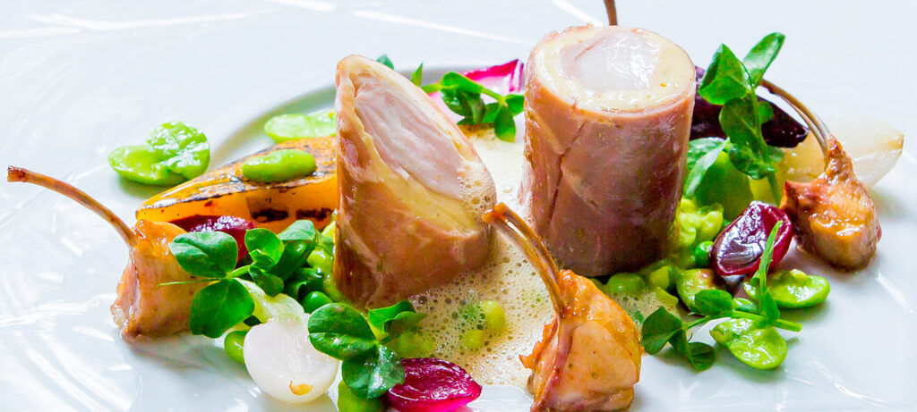 Loin Of Rabbit Wrapped In Parma Ham With Pea Mint Risotto